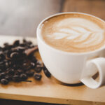 cup of coffee latte on wood table in coffee shop cafe